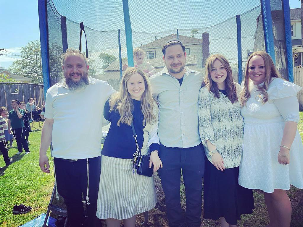 The Markovich family gathered outdoors