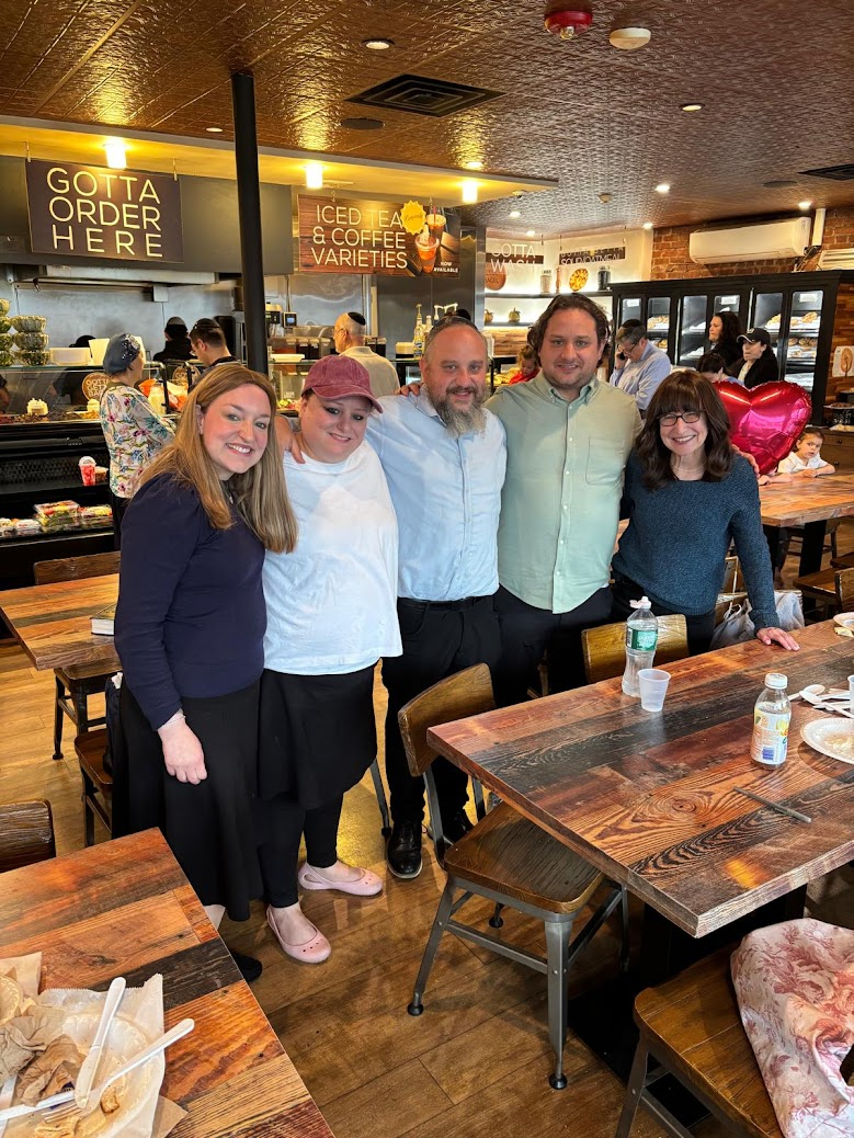 Five family members together at a restaurant